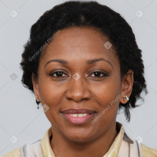 Joyful latino adult female with short  brown hair and brown eyes