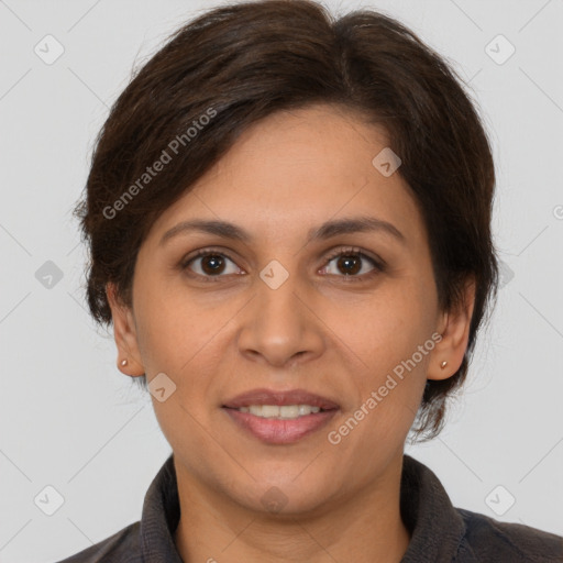 Joyful white adult female with medium  brown hair and brown eyes