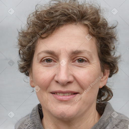 Joyful white adult female with medium  brown hair and blue eyes