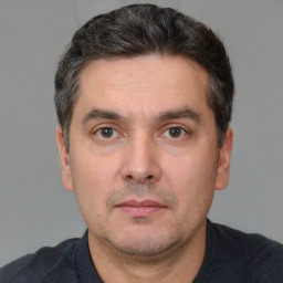 Neutral white adult male with short  black hair and brown eyes