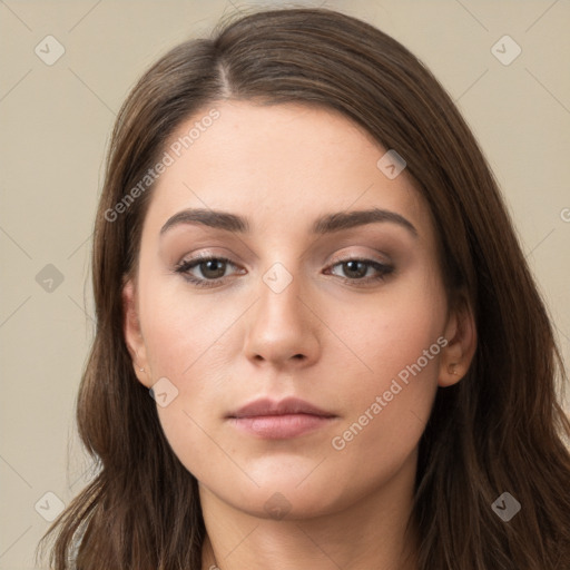 Neutral white young-adult female with long  brown hair and brown eyes