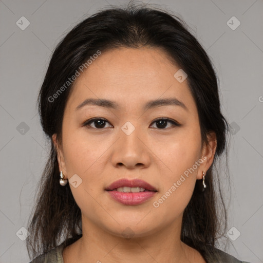 Joyful asian young-adult female with medium  brown hair and brown eyes