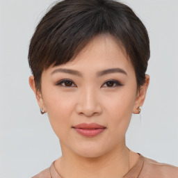 Joyful asian young-adult female with short  brown hair and brown eyes