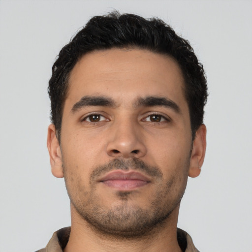 Neutral latino young-adult male with short  brown hair and brown eyes