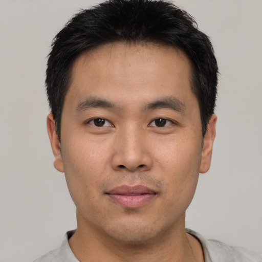 Neutral asian young-adult male with short  brown hair and brown eyes