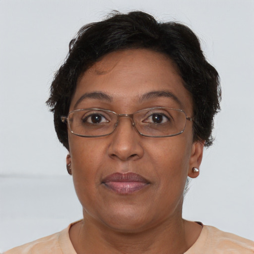 Joyful asian adult female with short  brown hair and brown eyes