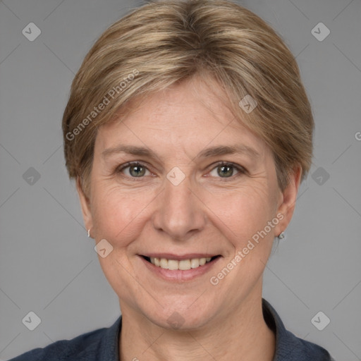 Joyful white adult female with medium  brown hair and grey eyes