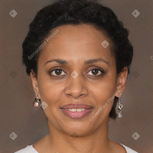 Joyful black adult female with short  brown hair and brown eyes