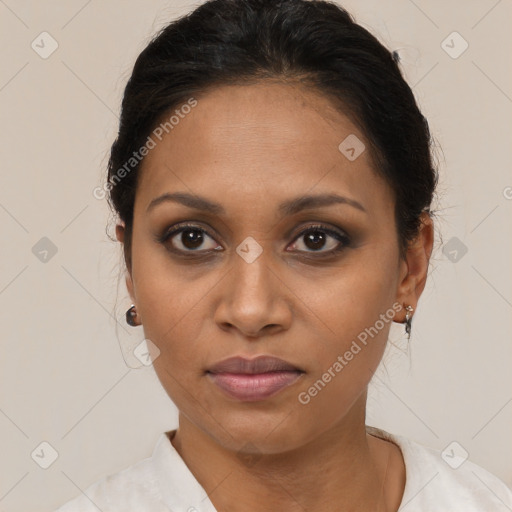 Joyful black young-adult female with medium  brown hair and brown eyes