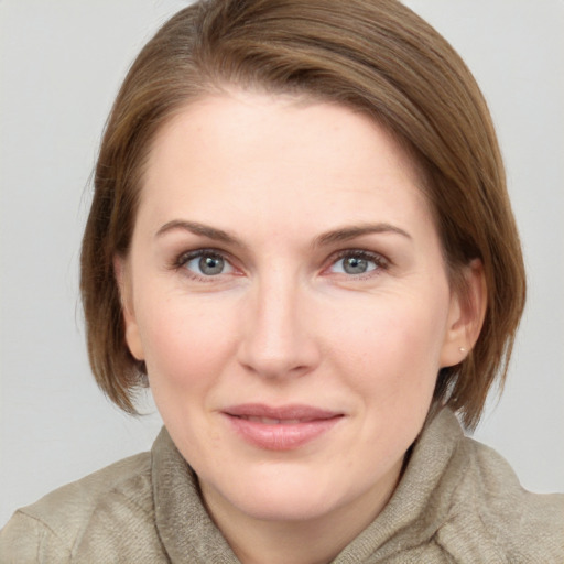 Joyful white young-adult female with medium  brown hair and blue eyes