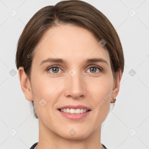 Joyful white young-adult female with short  brown hair and grey eyes