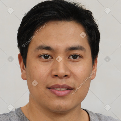 Joyful asian young-adult male with short  brown hair and brown eyes