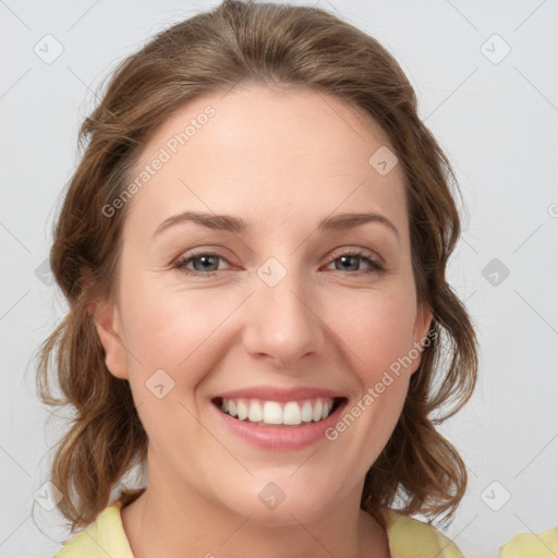 Joyful white young-adult female with medium  brown hair and green eyes