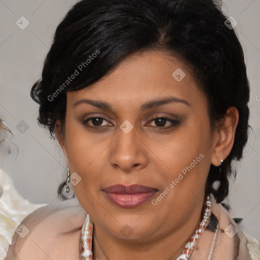 Joyful latino adult female with medium  brown hair and brown eyes