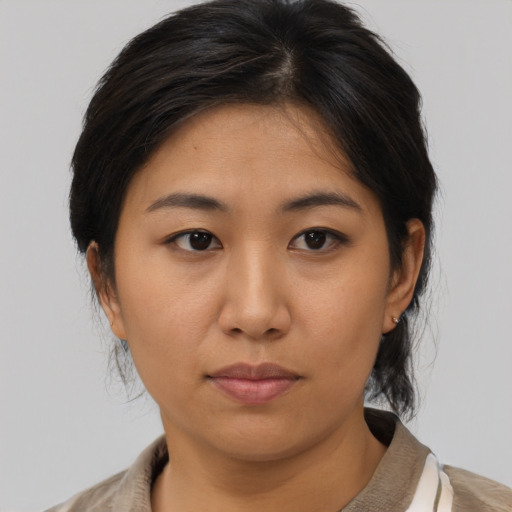 Neutral asian young-adult female with medium  brown hair and brown eyes