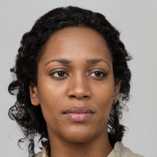 Neutral black young-adult female with medium  black hair and brown eyes