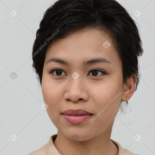 Joyful latino young-adult female with medium  brown hair and brown eyes