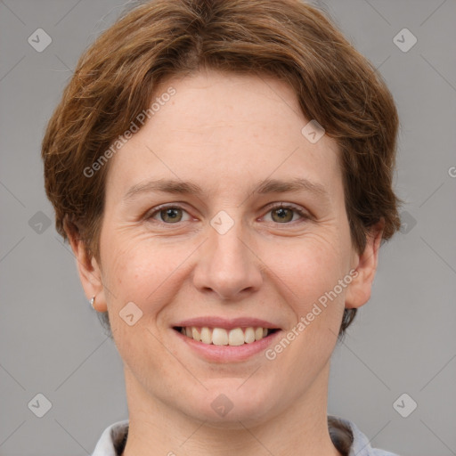 Joyful white adult female with short  brown hair and grey eyes