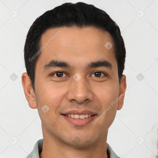 Joyful latino young-adult male with short  black hair and brown eyes