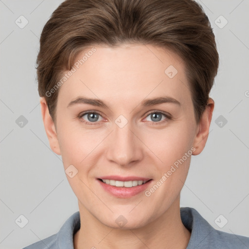 Joyful white young-adult female with short  brown hair and grey eyes