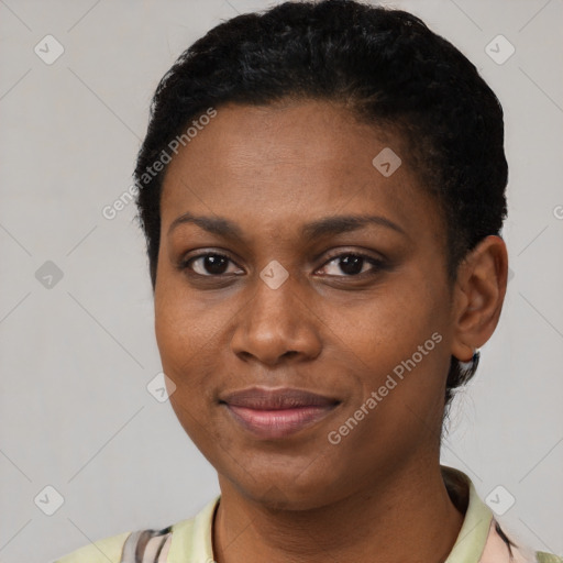 Joyful black young-adult female with short  brown hair and brown eyes