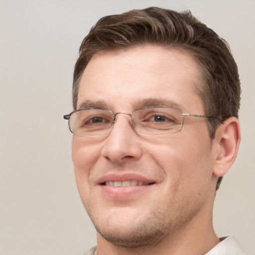 Joyful white adult male with short  brown hair and grey eyes