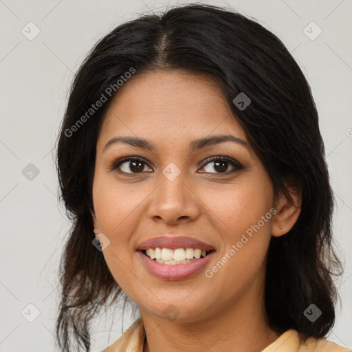 Joyful black young-adult female with medium  brown hair and brown eyes