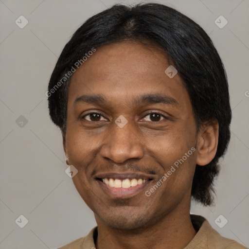 Joyful black adult male with short  black hair and brown eyes