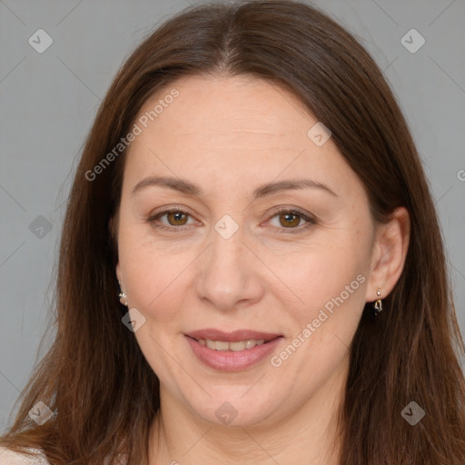 Joyful white adult female with long  brown hair and brown eyes