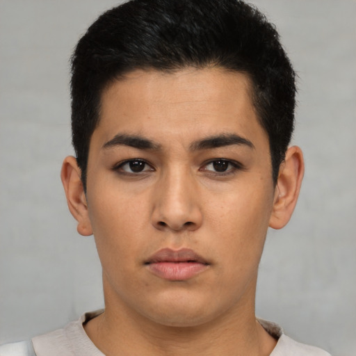 Neutral latino young-adult male with short  black hair and brown eyes