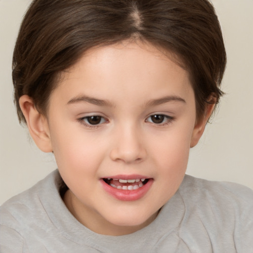 Joyful white child female with medium  brown hair and brown eyes