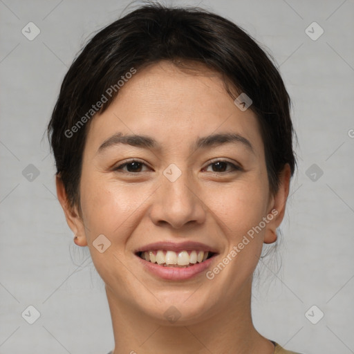 Joyful asian young-adult female with short  brown hair and brown eyes