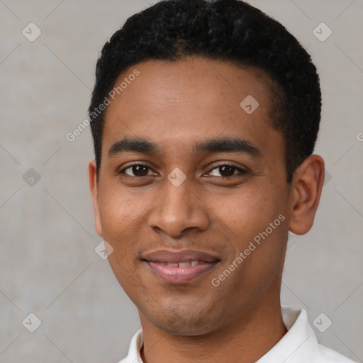 Joyful latino young-adult male with short  black hair and brown eyes