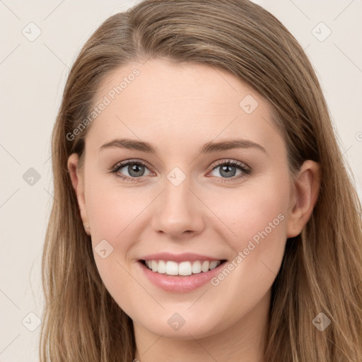 Joyful white young-adult female with long  brown hair and grey eyes