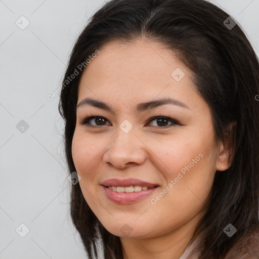 Joyful asian young-adult female with long  brown hair and brown eyes