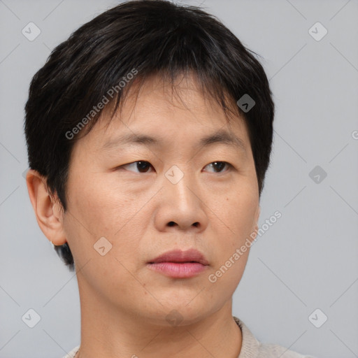 Neutral asian young-adult female with short  brown hair and brown eyes