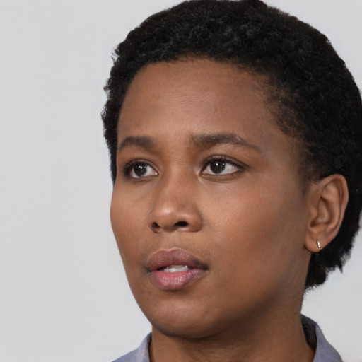 Neutral black young-adult female with short  black hair and brown eyes