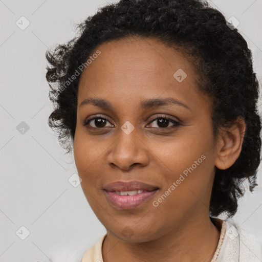 Joyful black young-adult female with medium  brown hair and brown eyes