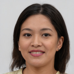 Joyful asian young-adult female with medium  brown hair and brown eyes