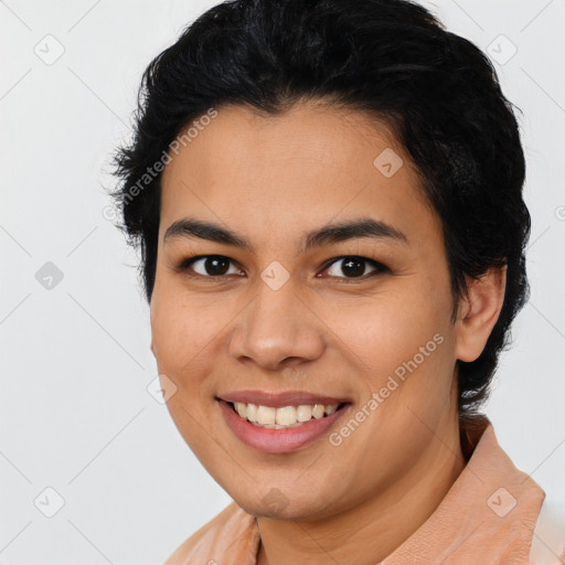 Joyful latino young-adult female with short  black hair and brown eyes