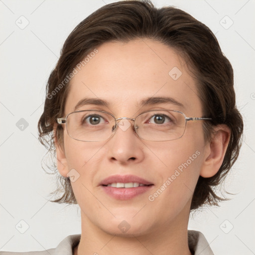 Joyful white adult female with medium  brown hair and grey eyes