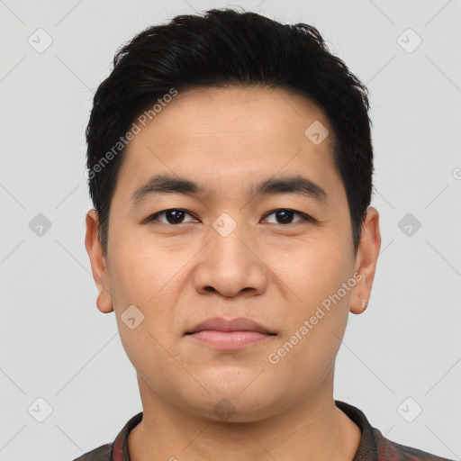 Joyful asian young-adult male with short  black hair and brown eyes