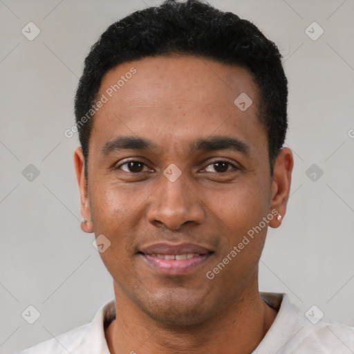 Joyful latino young-adult male with short  black hair and brown eyes