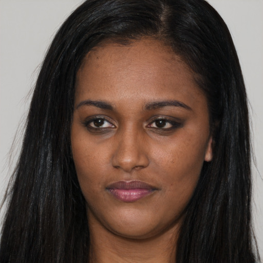 Joyful asian young-adult female with long  black hair and brown eyes