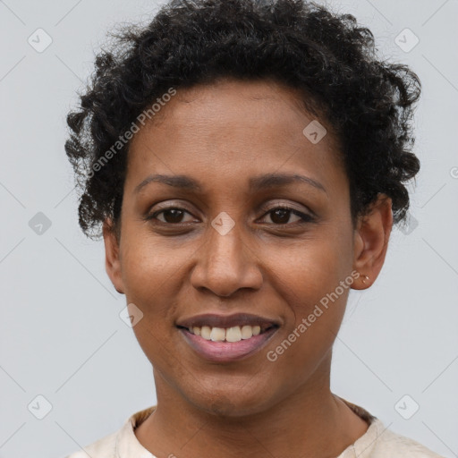 Joyful black young-adult female with short  brown hair and brown eyes