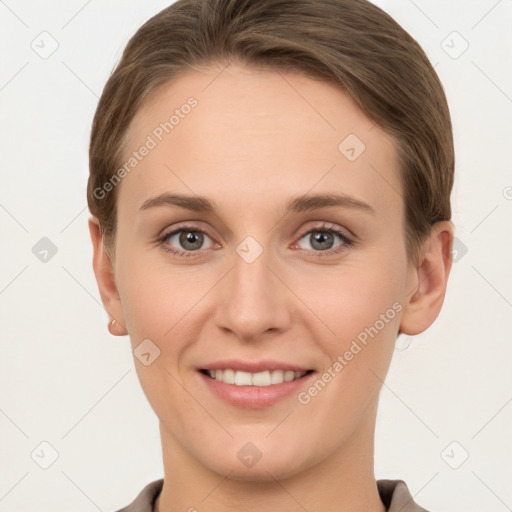 Joyful white young-adult female with short  brown hair and grey eyes