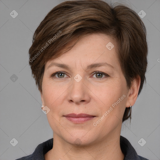 Joyful white adult female with medium  brown hair and grey eyes