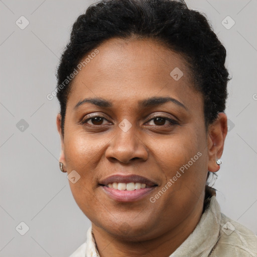 Joyful black young-adult female with short  brown hair and brown eyes