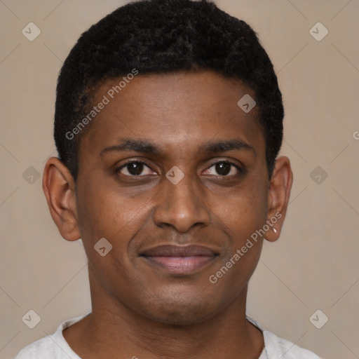 Joyful black young-adult male with short  brown hair and brown eyes