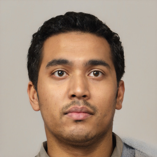 Neutral latino young-adult male with short  black hair and brown eyes
